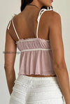 solid-ruffle-hem-tie-bow-cami-top