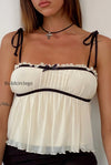solid-ruffle-hem-tie-bow-cami-top